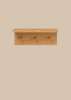 The Ferm Living Place Rack - Small is a simple oak wall rack with three round pegs for hanging items, ideal for home organization, shown mounted on a light beige background.