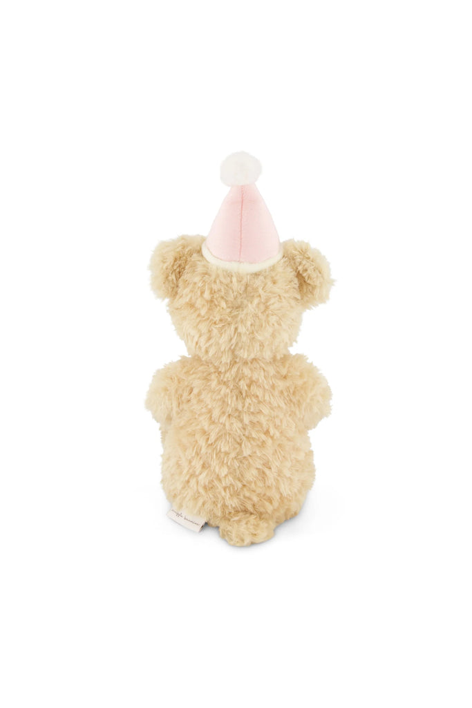 Snuggle Bunnies - Birthday Arthur - Fairy sits facing away on a white background, featuring a fluffy beige body and wearing a pale pink party hat with white trim and pom-pom.