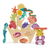 A colorful wooden stacking toy featuring sea creatures such as a seahorse, fish, coral, and starfish, creatively arranged to fit within a frame shaped like ocean waves and seabed - Stacking Coral Reef.