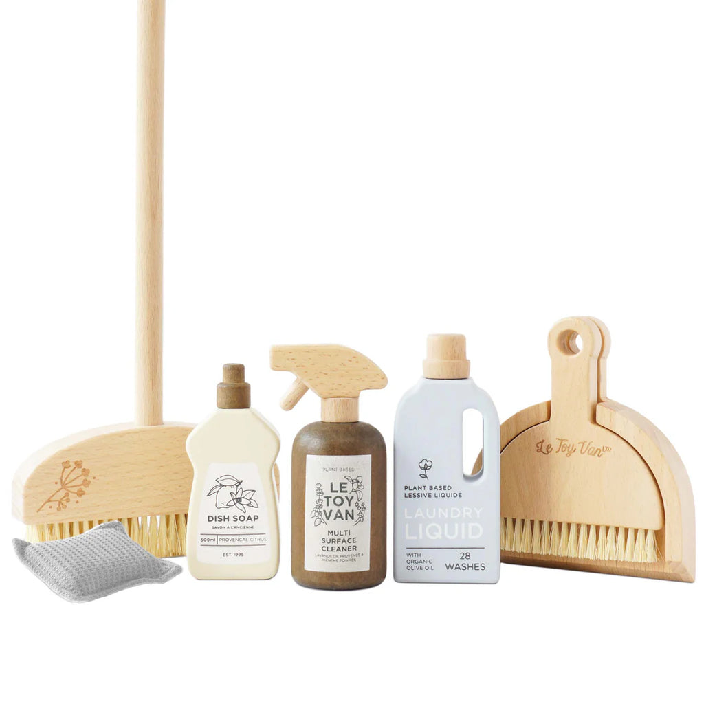 The Pretend Play Cleaning Set is a child-safe toy made from FSC-certified wood, featuring wooden cleaning tools including a broom, dustpan, and bottles of dish soap and multi-surface cleaner. Each piece has eco-friendly motifs for playful learning.