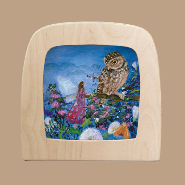 The product, "Silhouette Only - Little Fairy Can't Sleep Silhouette - Owl for Toverlux Lamp," depicts a fairy in a red dress among flowers facing an owl on a branch, framed in a wooden square with rounded corners on a solid tan backdrop.