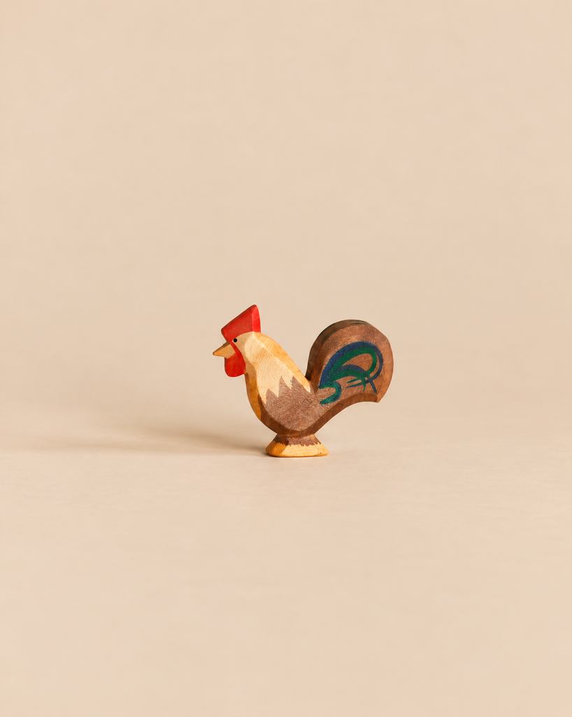 An Ostheimer Rooster - Brown handcrafted wooden figurine with a red comb and a dark-toned tail, perfect for imaginative play.