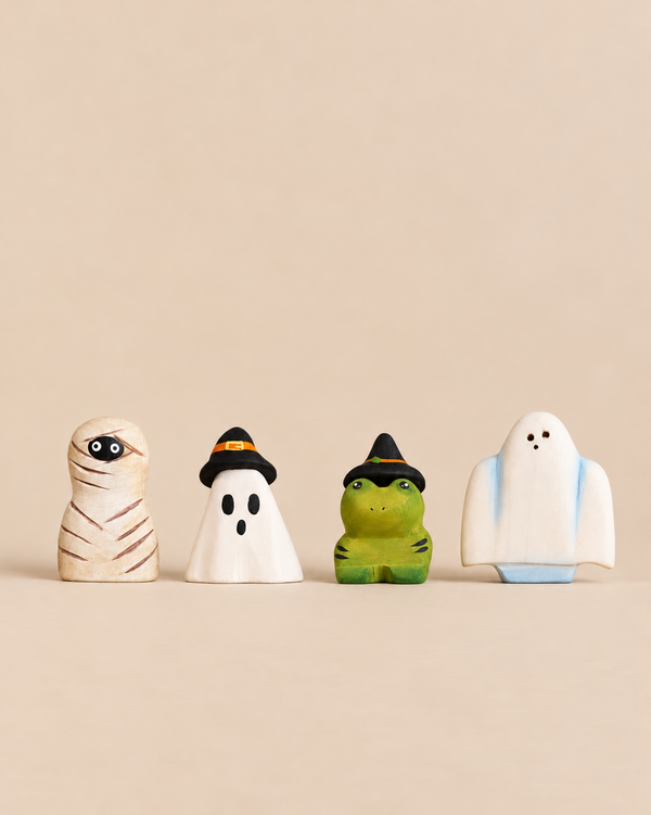 Bumbu Handmade Wooden Halloween Friends Set featuring four wooden figurines: a mummy, a ghost in a witch hat, a green frog in a witch hat, and a ghost, perfect for small world play.