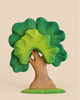 Bumbu Handmade Wooden Extra Large Green Oak Tree featuring a brown trunk and layered, light and dark green foliage on a round, dotted green base.