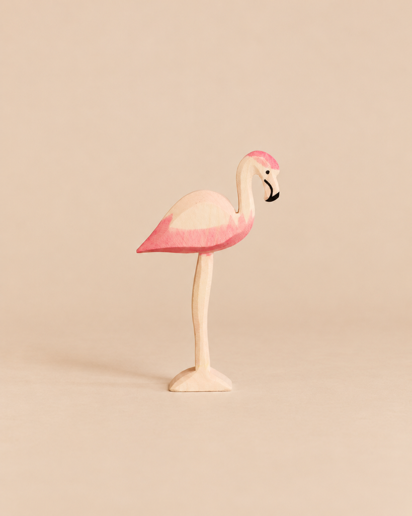 Hand-painted, handcrafted Ostheimer Flamingo wooden toy in pink and white with a black-tipped beak.