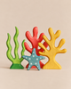 Handmade Holzwald Coral Reef set including a green seaweed shape, a red coral shape, a yellow branching coral shape, and a blue dotted starfish.