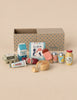 Maileg Little Sister’s Kitchen Set featuring a carton of milk, a tub of ice cream, a popsicle, juice cans, honey, cheese, sausage, mayonnaise, and a carton of eggs.