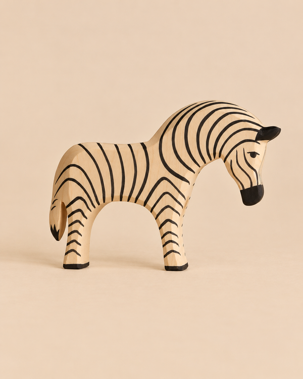 Ostheimer Zebra, a hand-carved wooden toy with black painted stripes, perfect for imaginative play.