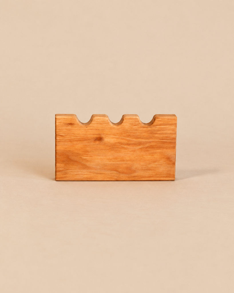 An Ostheimer Castle Wall handcrafted wooden block with a crenellated top edge.