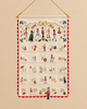 Nutcracker Embroidered Hanging Advent Calendar - Red featuring embroidered designs, numbered pockets, and a dangling Nutcracker figurine ornament at the number 24 pocket.