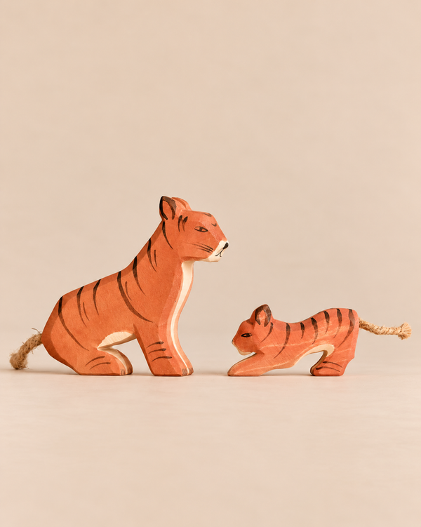 Ostheimer Handmade Wooden Tiger Set featuring an adult and a cub, both handcrafted from wood with rope tails.