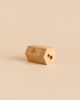 Hexagonal Stockmar Dual Pencil Sharpener with two holes, steel blades, and a small logo on the side.