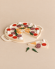 Sabo Concept Wooden Pizza set with removable toppings including sliced mushrooms, pepperoni, and herbs, with one pretend play food slice separated from the whole.