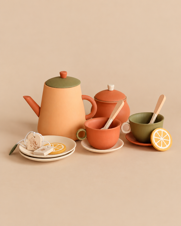 Sabo Concept Handmade Wooden Tea Set - Herbal, featuring a teapot, sugar bowl, two cups on saucers, two spoons, two tea bags, and two lemon slices for pretend play.