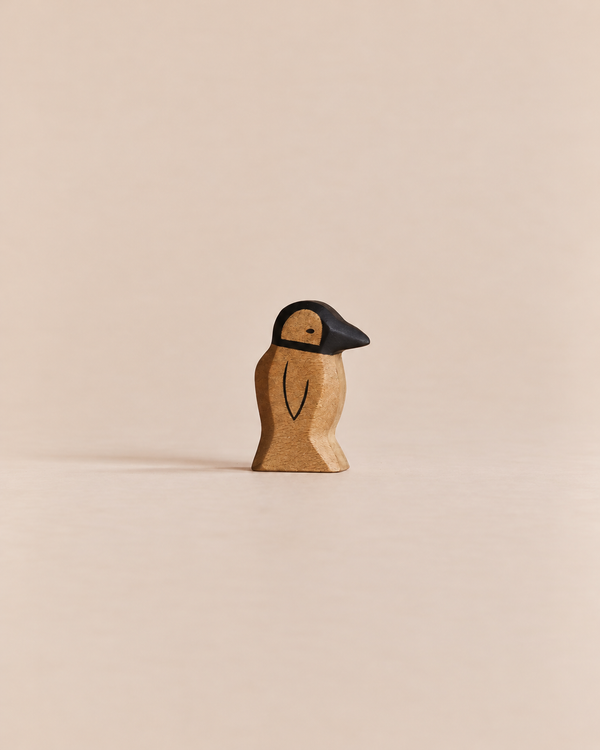 Handmade Holzwald Penguin, Small, crafted from wood with a black head and beak.
