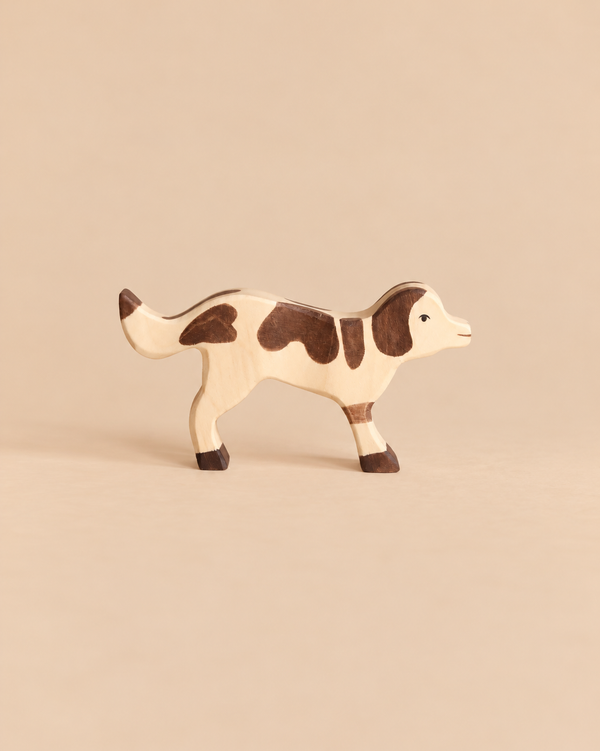 Holztiger Farm Dog, a handcrafted wooden toy figure with brown patches.