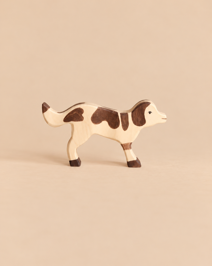 Holztiger Farm Dog, a handcrafted wooden toy figure with brown patches.