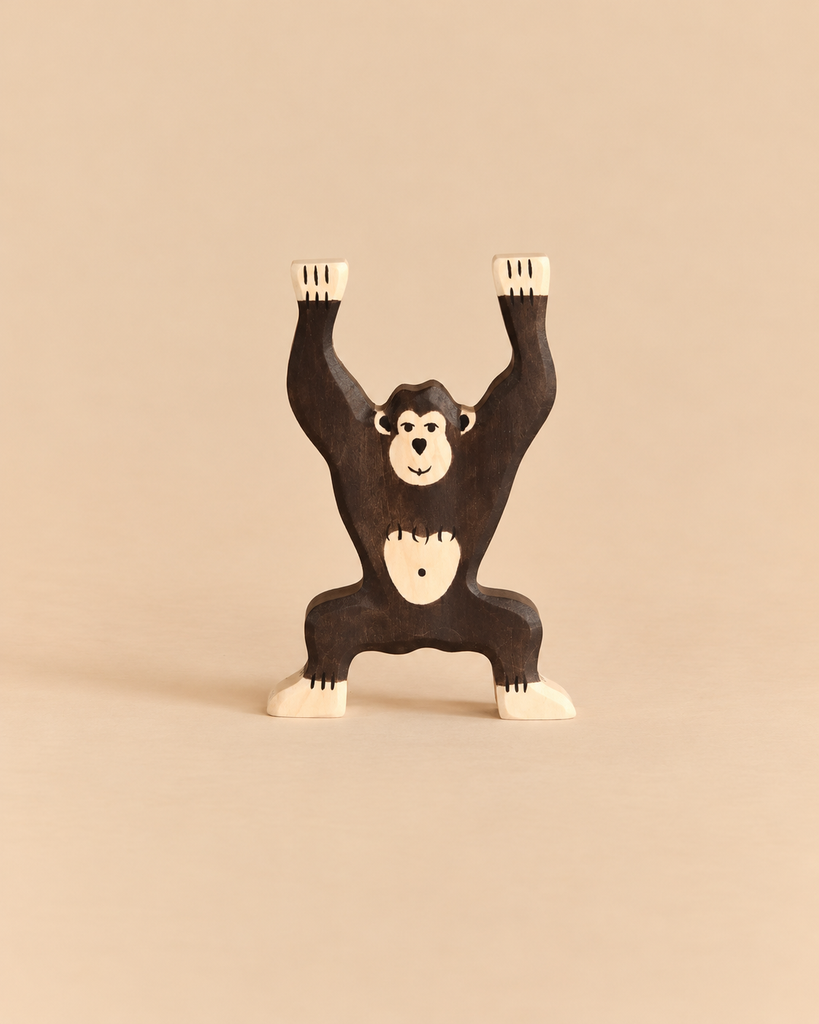 A handcrafted wooden Holztiger Chimpanzee, Standing toy with its arms raised.