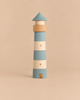 The Sabo Concept Lighthouse is a stackable wooden playset designed as a lighthouse, featuring segments in blue and natural wood tones for a maritime adventure.