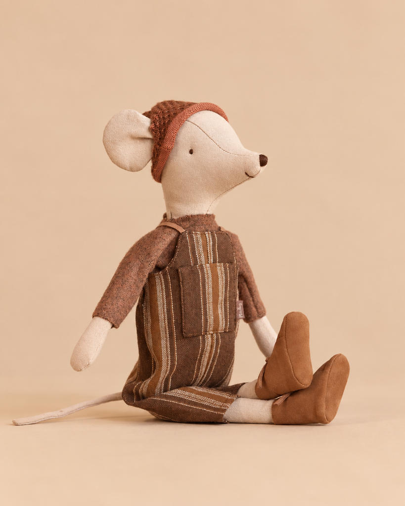 Maileg Mouse, Medium - Overall and Sweater wearing a knitted hat, soft brown sweater, striped overalls, and boots.