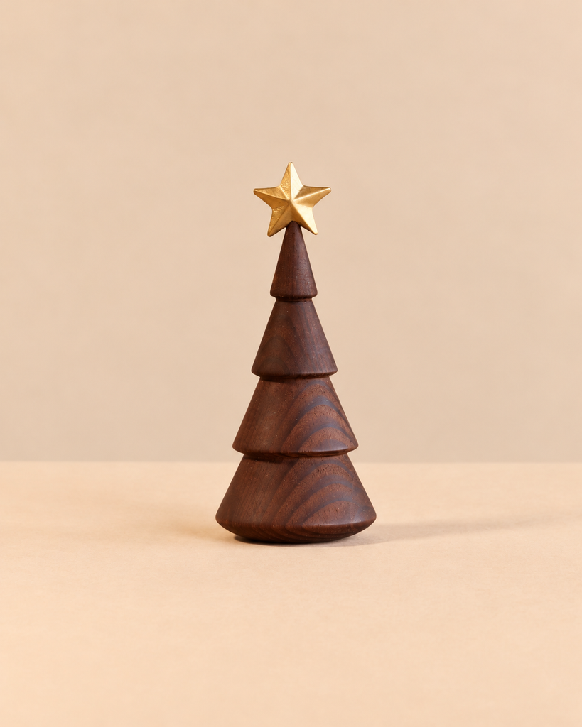 Spring Copenhagen The Christmas Tree in thermo beech is a stylized, tiered wooden tree topped with a small gold star.