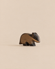 A Handmade Holzwald Badger, a carved wooden toy figurine of a badger.