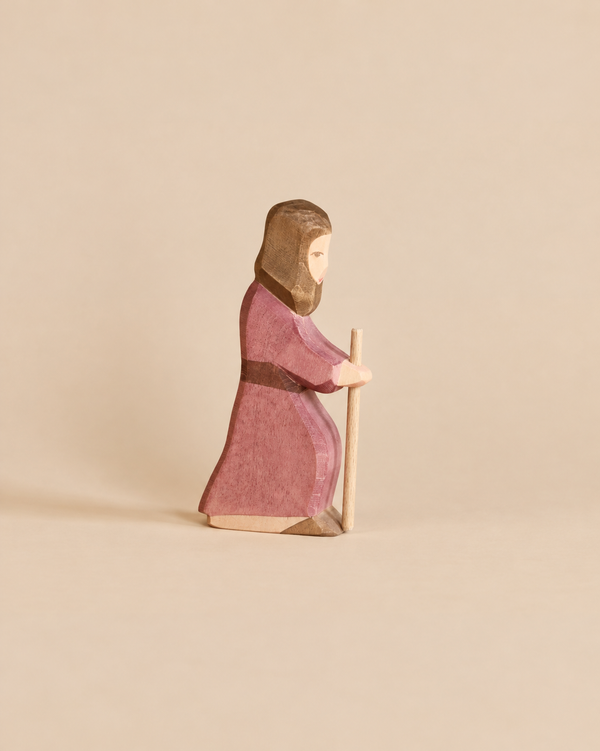 Hand-painted Ostheimer Joseph - Standing wooden figurine of a man in a mauve robe holding a staff, designed for imaginative play.