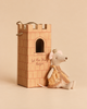 A Maileg Princess Mouse, Big Sister wearing a gold crown and yellow dress sits next to a cardboard tower box labeled “Princess” and “Let the Story begin.”