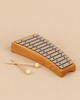 A Choroi Diaronne Diatonic Glockenspiel - 13 tones made of cherry wood with thirteen steel bars and two mallets.