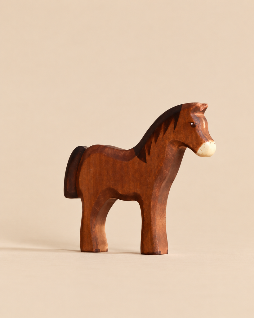 A dark brown Handmade Holzwald Horse - Dark Brown figurine standing in profile, designed for imaginative play.