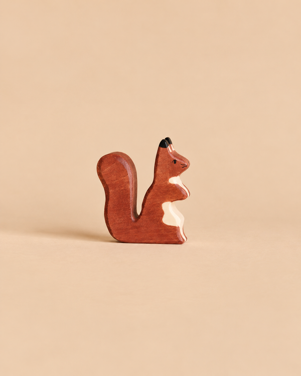 A Holztiger Squirrel, Brown, handcrafted from wood with a bushy tail in shades of brown and cream.