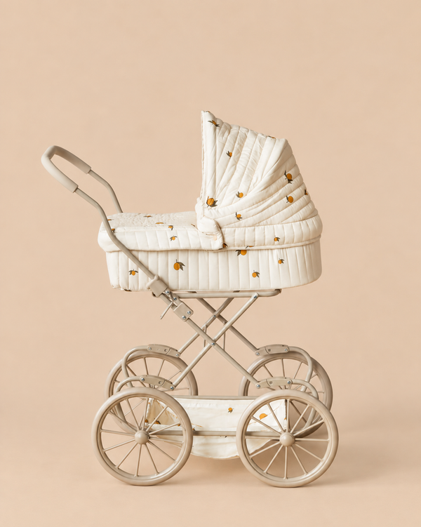 Konges Sloejd Doll Pram - Lemon in cream with a yellow lemon print and large wheels.