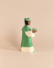 An Ostheimer Green King With Crown handcrafted wooden toy figurine wearing a green robe and holding a small green gift.