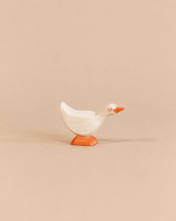 Ostheimer Goose - Standing handcrafted wooden toy in a standing position with an orange beak and feet, perfect for imaginative play.