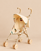 Konges Sloejd Zoe Doll Stroller With Canopy - Cherry Glitter featuring a beige fabric canopy and seat with double wheels and a red cherry print.