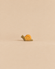 A small Handmade Holzwald Snail, Small with a tan body and a yellow spiral shell.