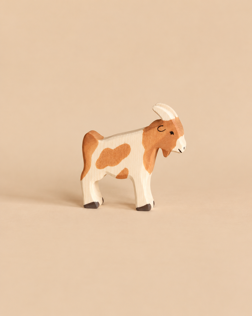 Holztiger Billy-Goat handcrafted wooden toy with brown and white markings.