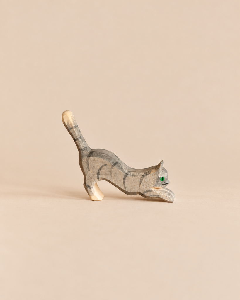 Ostheimer Cat - Gray, Jumping, a handcrafted wooden toy cat in a gray striped coat, captured in a jumping or pouncing pose.