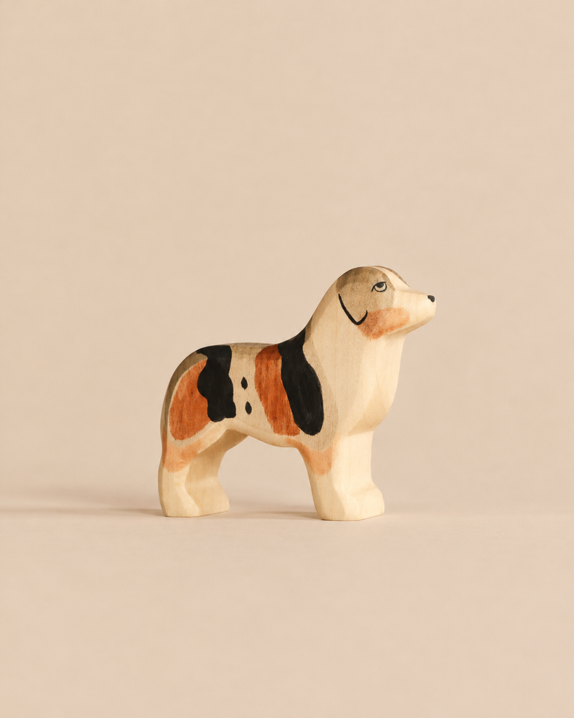Handmade Holzwald Dog - Australian Shepherd figurine, a small wooden standing dog with brown, black, and white markings, perfect for imaginative play.