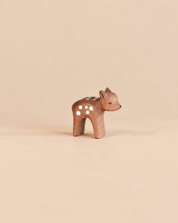 Handcrafted Ostheimer Deer - Small, Head Low figurine with white spots on its back and its head lowered.