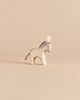 An Ostheimer Donkey - Small, a handcrafted wooden toy featuring a gray painted mane and a short string tail.