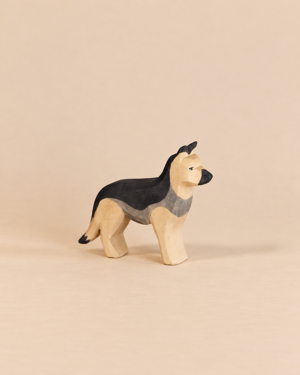 Hand-carved Ostheimer Dog - German Shepherd wooden figure with a black and tan painted finish, perfect for imaginative play.