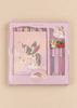 A Konges Sloejd My Stationery Box - Unicorn containing a pink A5 spiral-bound notebook with a unicorn illustration, four shaped paper clips, and two glitter gel pens topped with a unicorn and two cherries.