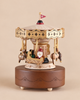 Christmas Carousel Music Box featuring a Santa figure in a sleigh with reindeer attachments under a decorative canopy.