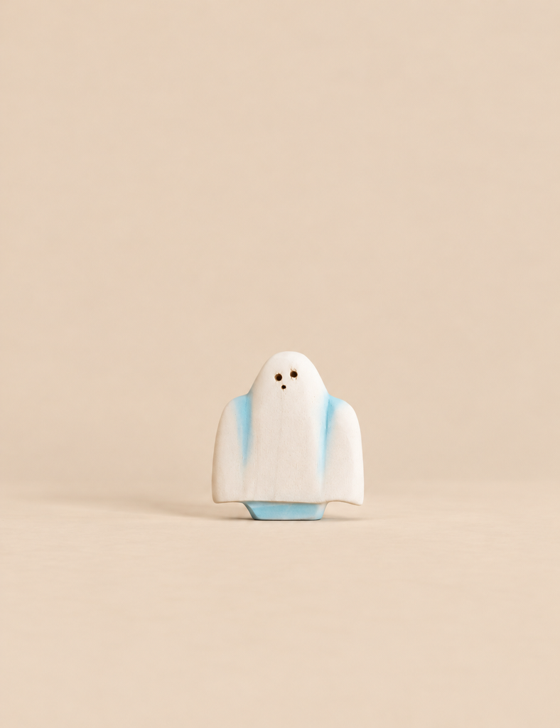 Bumbu Handmade Wooden Ghost figurine with a white body, blue accents, and three small dark dots for eyes and a mouth.