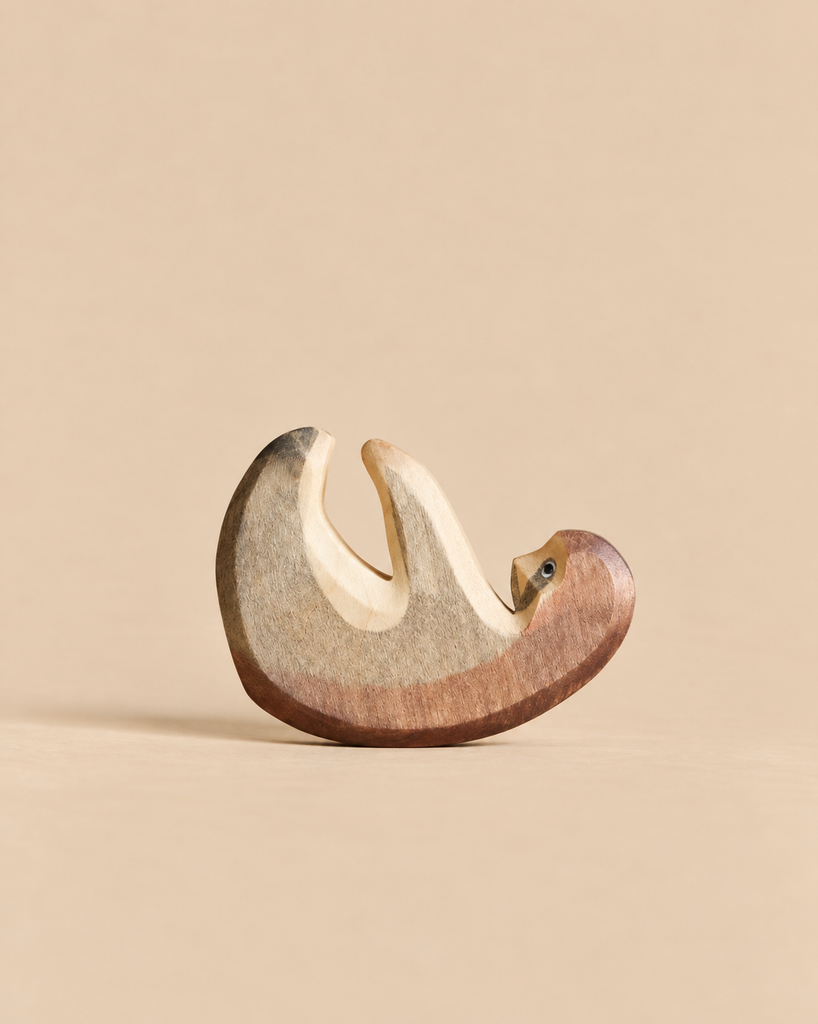 Handmade Holzwald Sloth, a sustainable wooden toy in the shape of a sloth.