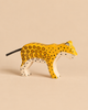 Hand-painted Holztiger Leopard wooden figurine featuring spotted markings and a cord tail.