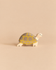 Holztiger Tortoise, a handcrafted wooden toy with a grey shell featuring a yellow grid pattern, perfect for open-ended play.