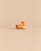 Handcrafted wooden Ostheimer Hen Brown On Nest shaped as a brown hen with a red comb and yellow beak, sitting as if on a nest.