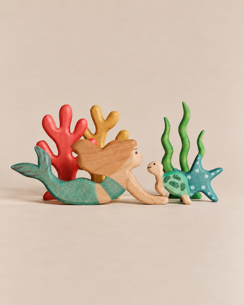 Handmade Holzwald Mermaid Set featuring a mermaid and a sea turtle surrounded by colorful coral and seaweed figures.
